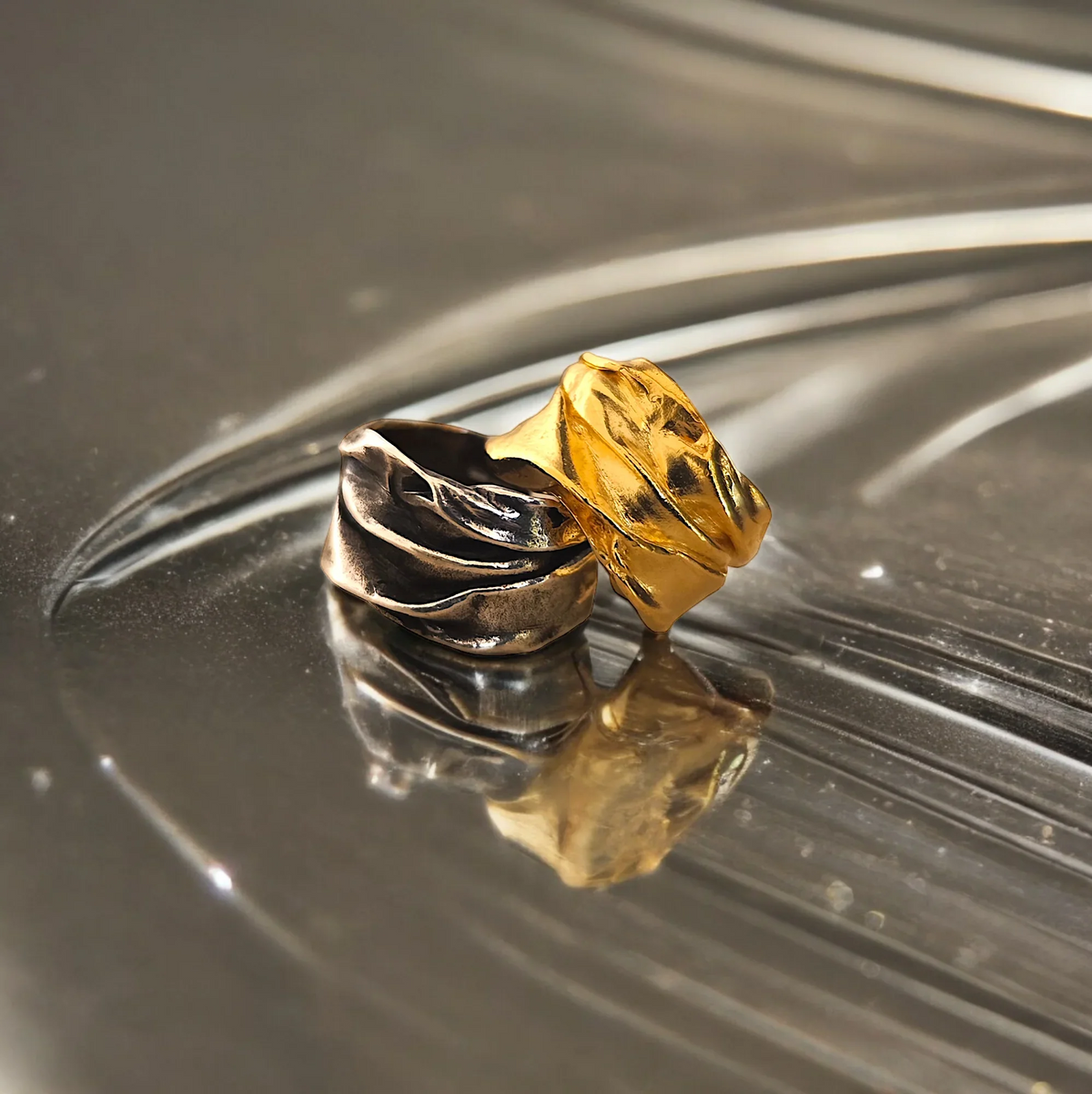 Original Athenart Peplos rings—oxidized silver and gold-plated with draped folds
