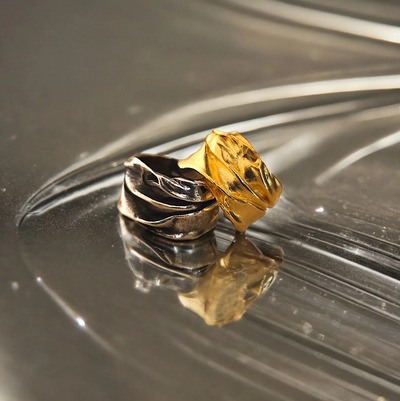 Original Athenart Peplos rings—oxidized silver and gold-plated with draped folds