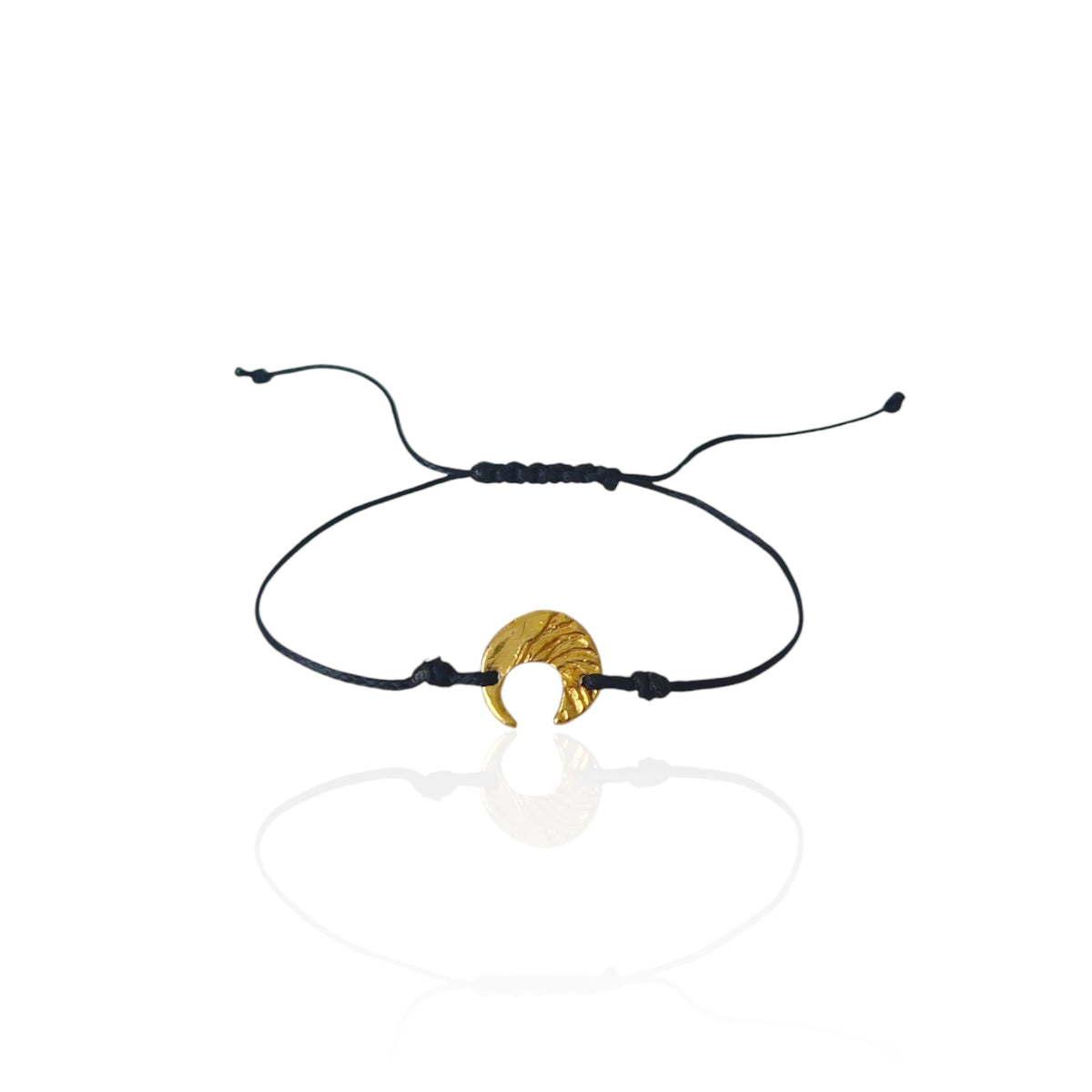 Moon Whisper gold-plated sterling silver moon bracelet worn on the wrist with black cord.