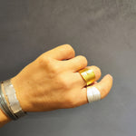 Peplos Drapé adjustable silver ring in four finishes worn on hand