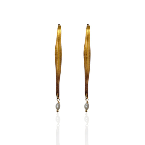 Pair of long, thin earrings with a central pearl on a white background