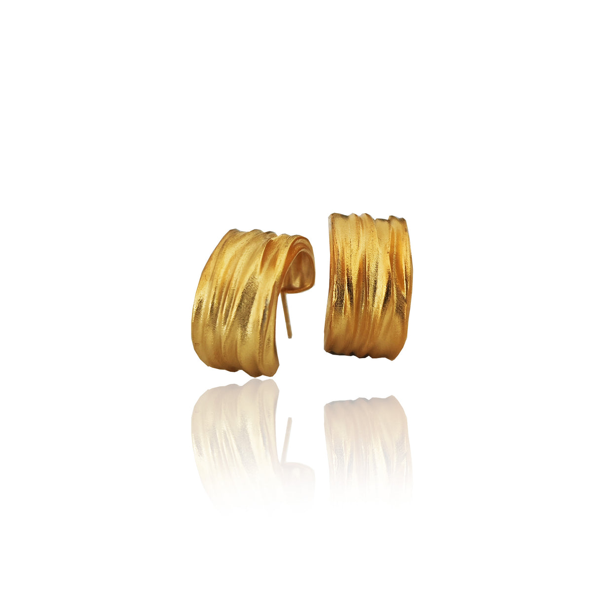 Peplos Flow Hoops by Athenart in silver, gold plated, or oxidized finish. Handmade Greek jewelry inspired by the folds of the ancient Peplos.