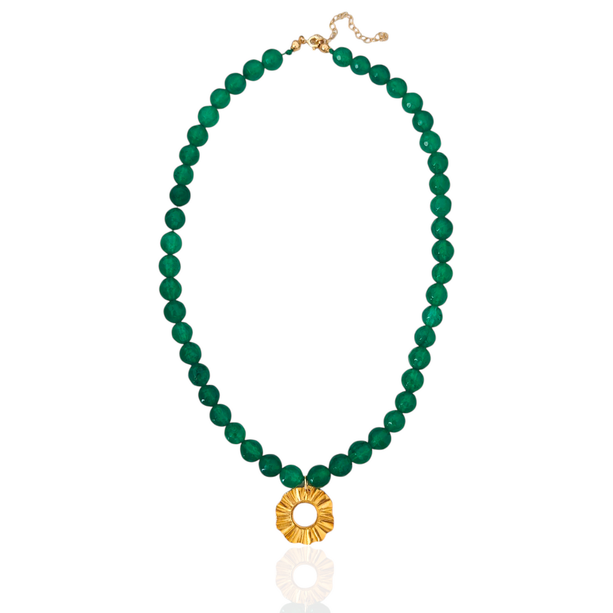 Green beaded necklace with a gold pendant on a white background