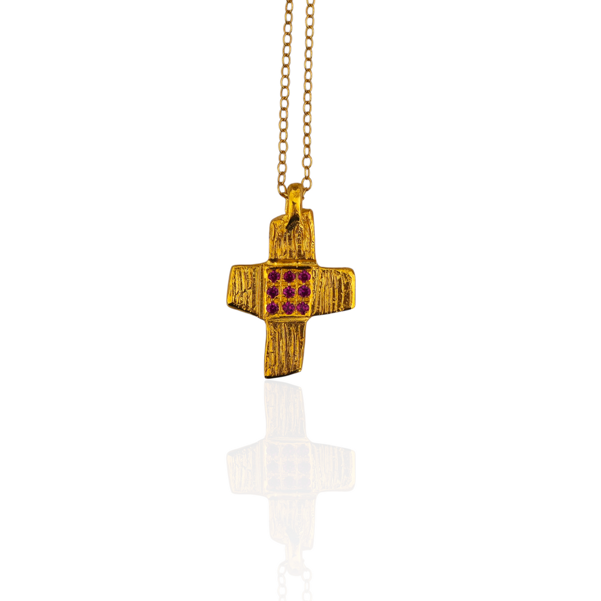 Gold cross pendant with red stones and gold chain 