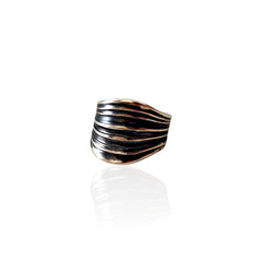 Partly oxidized black silver ring with carved fold details
