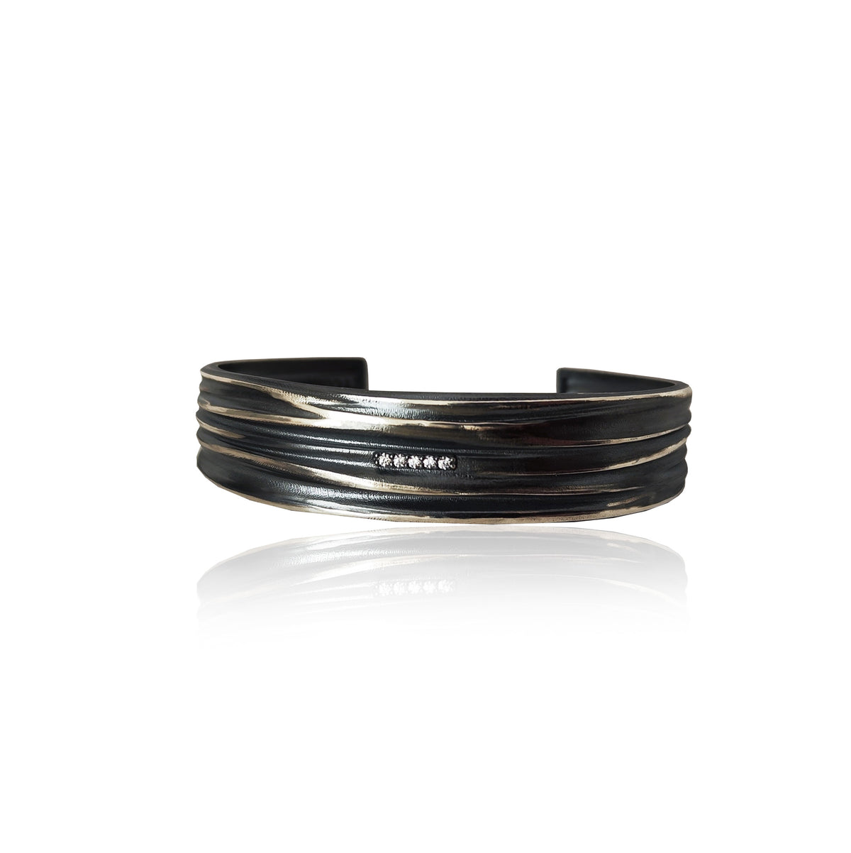 Athenais wide flow cuff bracelet in oxidized sterling silver with zircon row