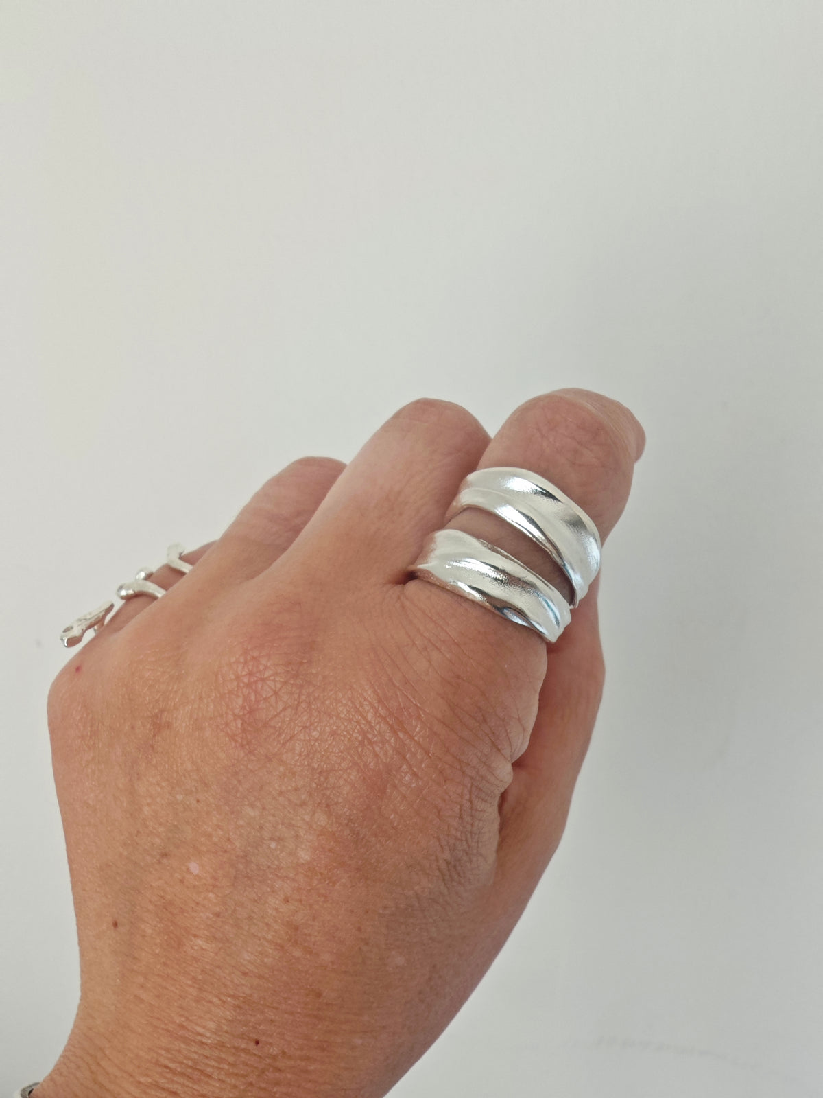 Sculptural silver 925 double band ring worn on hand