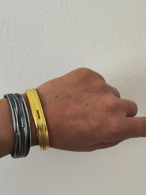 Athenais cuff bracelet close-up of zircon detail on flow texture