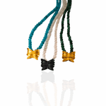 Chrysalis necklace detail showing butterfly charm and jade beads