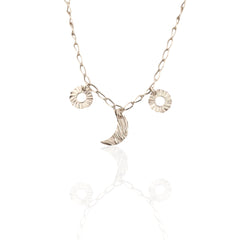 Helios and Selene charm necklace in silver with moon and sun charms