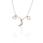 Helios and Selene charm necklace in silver with moon and sun charms
