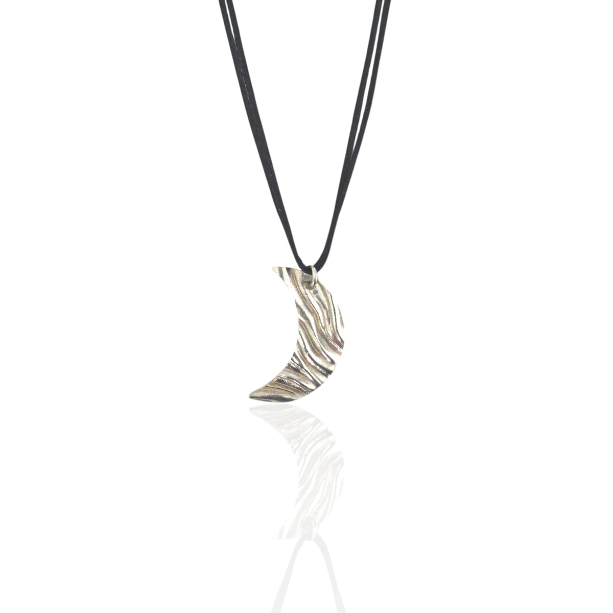 Silver crescent moon pendant on a black cord against a white background