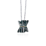 Necklace with a black and silver pendant on a white background