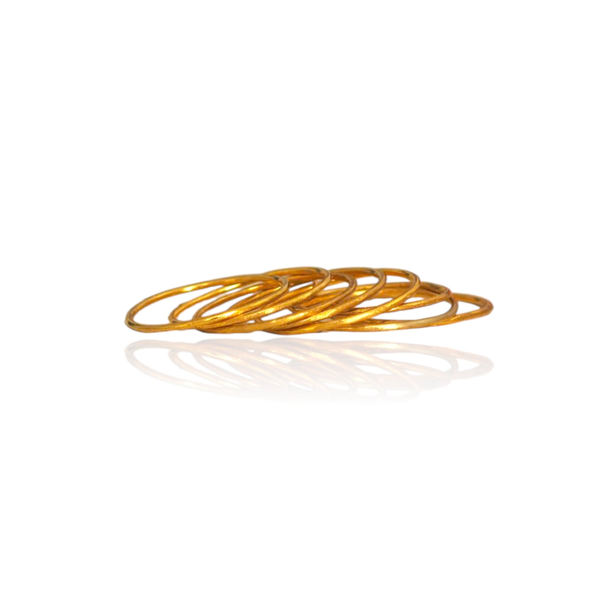 Handmade Greek jewelry solid gold stacking rings on white background
