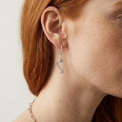 Minimal silver fish earrings with textured fins and zircon