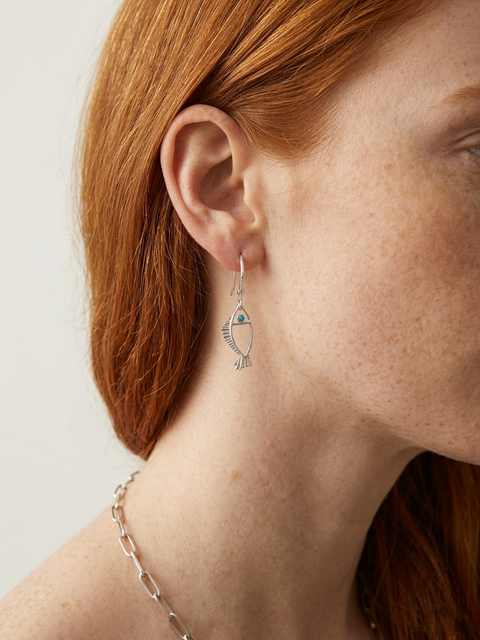 Minimal silver fish earrings with textured fins and zircon