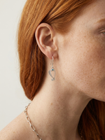 Minimal silver fish earrings with textured fins and zircon