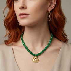 Green agate necklace with Helios sun charm worn on model