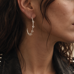 Model wearing silver Rhythm Line hoop earring handmade in Athens
