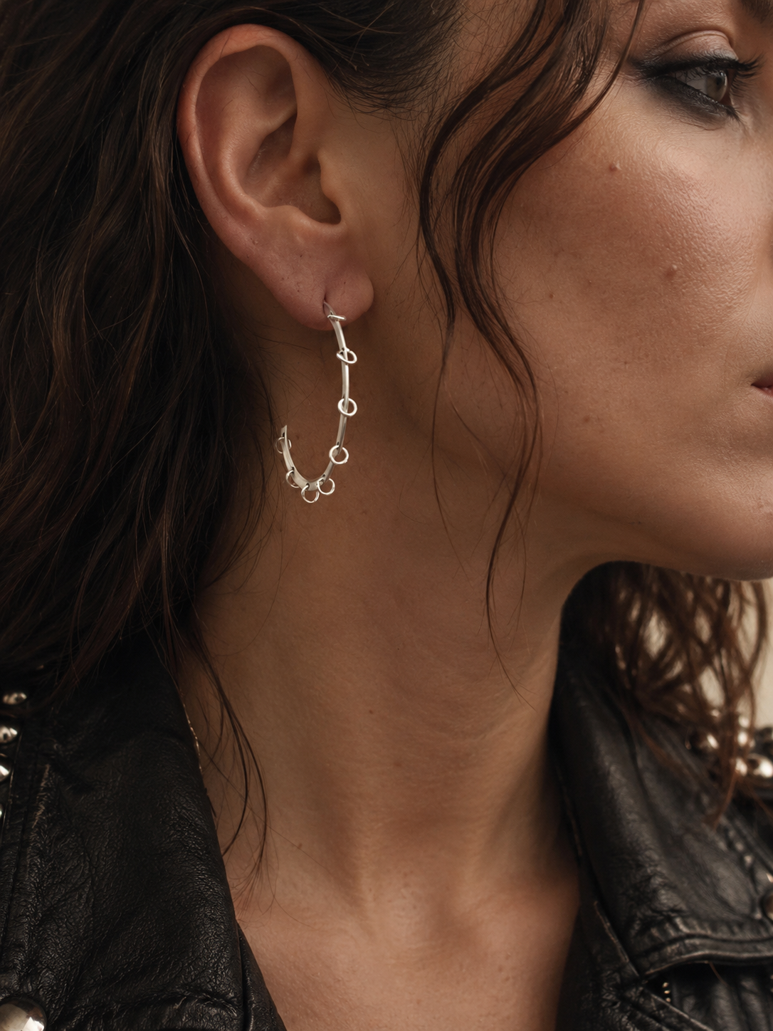 Model wearing silver Rhythm Line hoop earring handmade in Athens