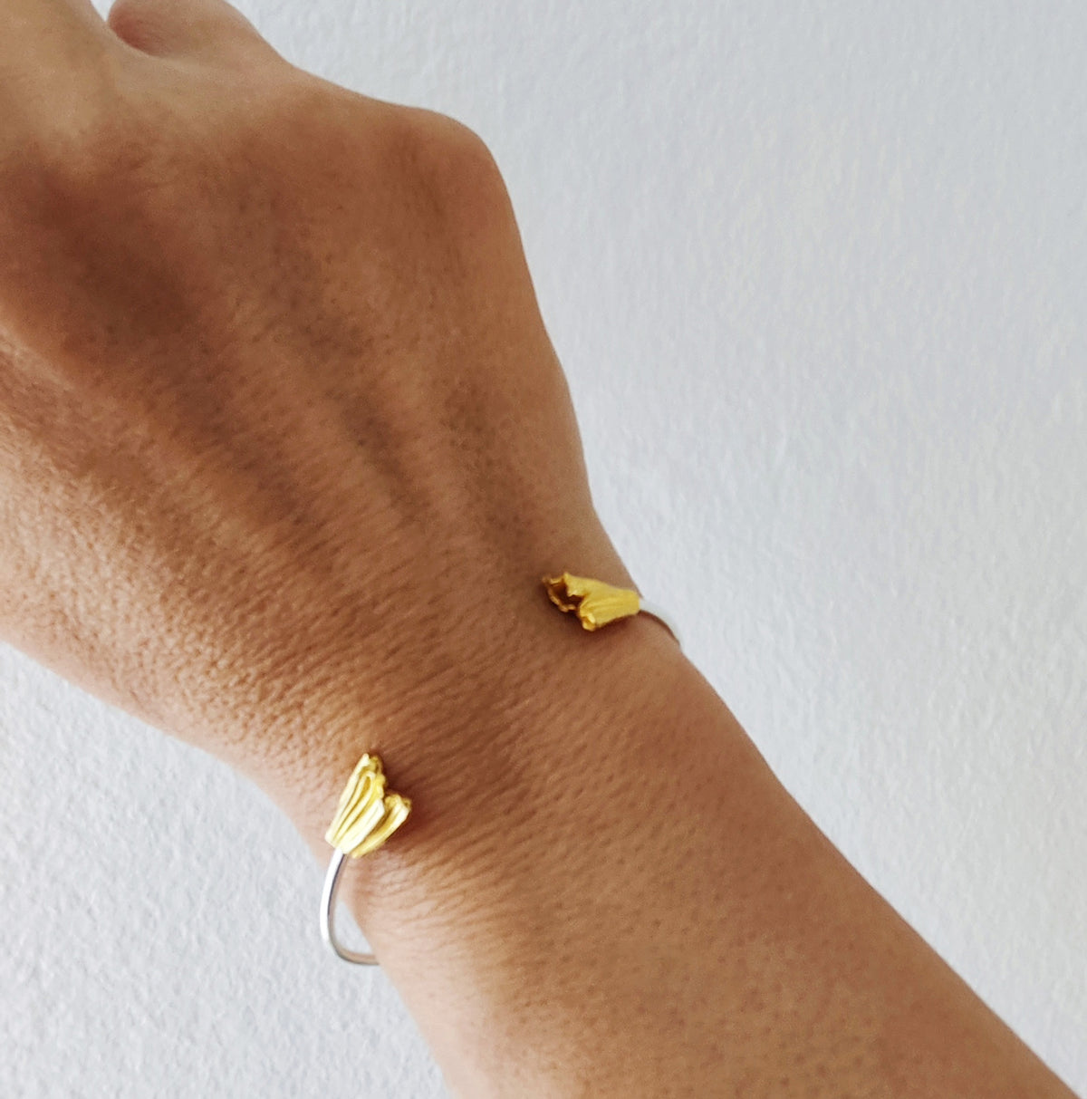 Athenais fold cuff bracelet in gold and silver handmade by Athenart Jewelry