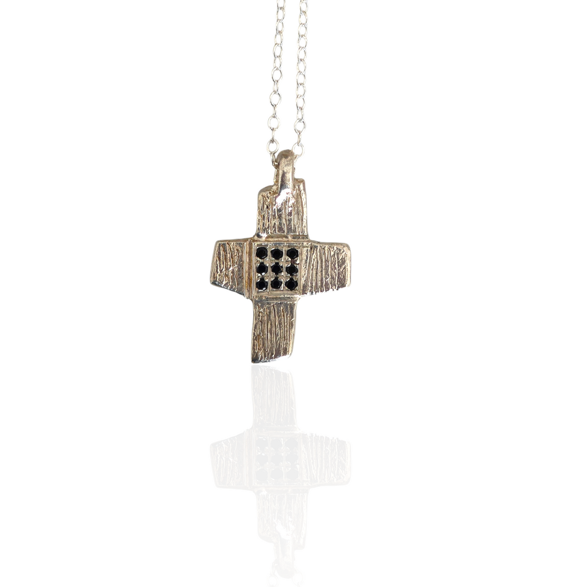 Silver cross and silver chain and black zircons cross