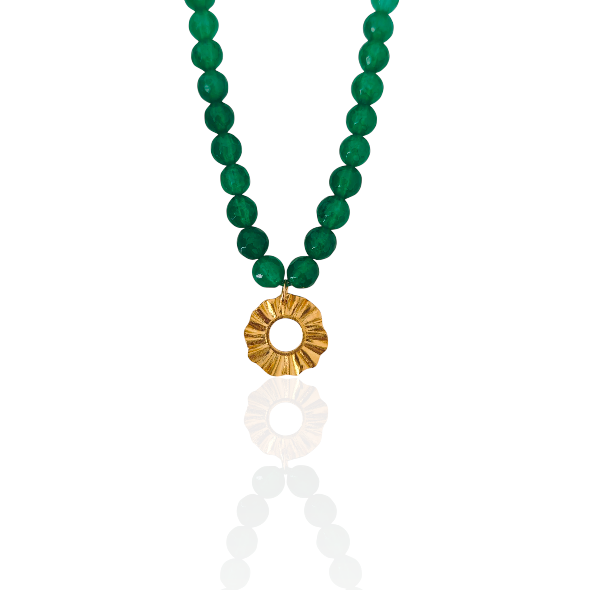 Green beaded necklace with a gold pendant on a white background