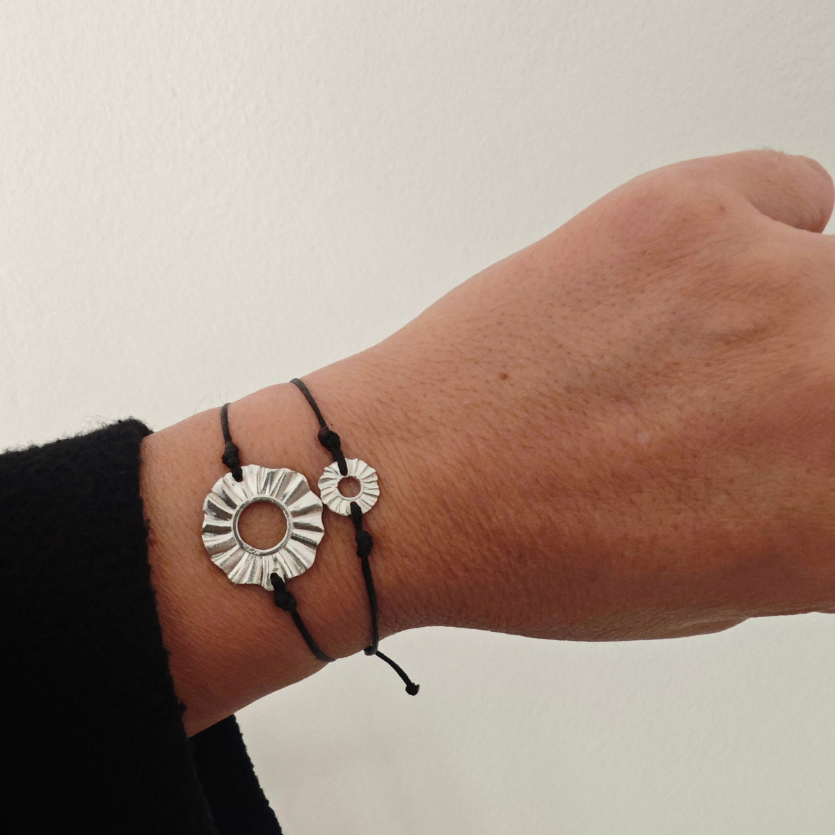 Athenart Helios cord bracelets—small 1 cm and medium 2 cm in sterling silver, stacked on wrist, handmade in Athens