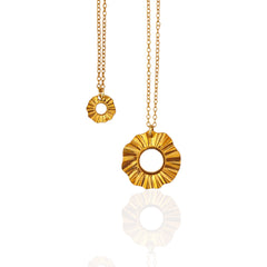 Helios Guardian Sun lucky charm pendants in silver and gold-plated on chains, product photo on white, Athenart Jewelry.