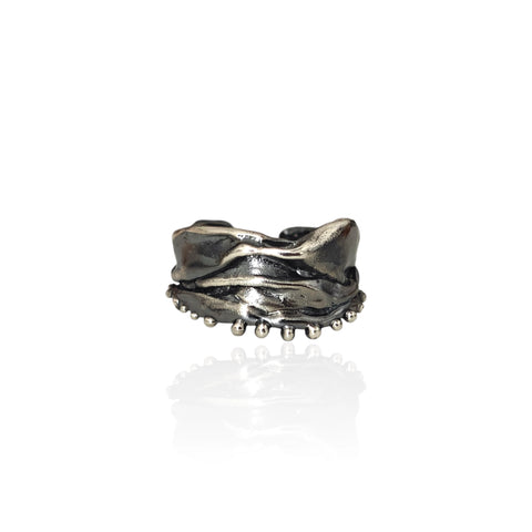Athenais Hemline Ring in oxidized 925 silver with draped folds and beaded hem on white background.