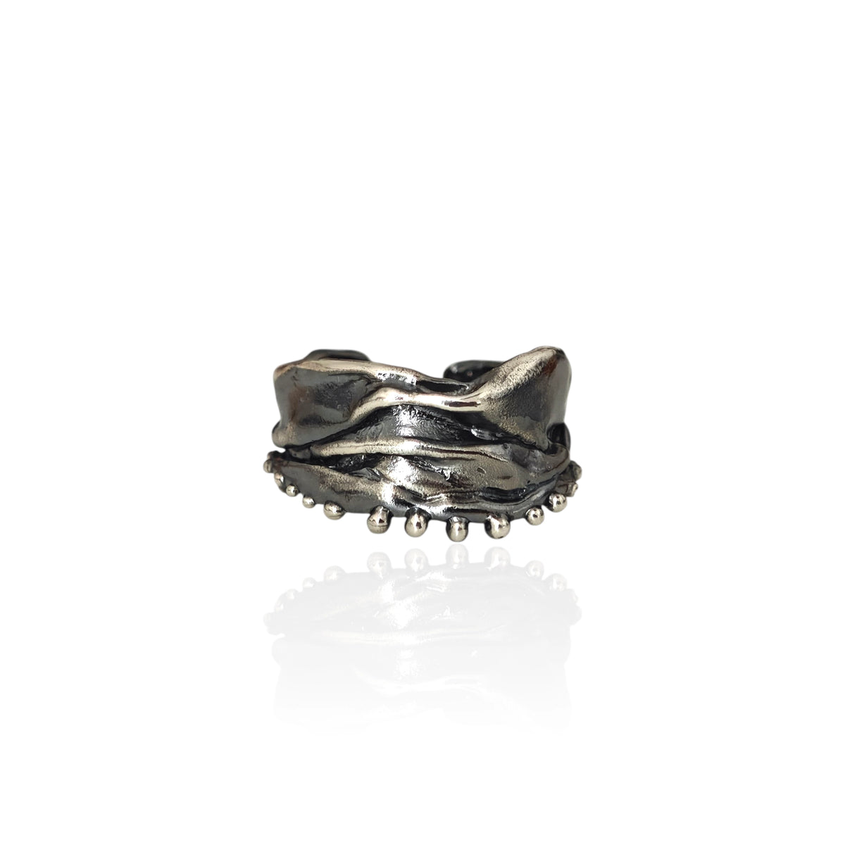Athenais Hemline Ring in oxidized 925 silver with draped folds and beaded hem on white background.