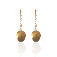 Luxury handcrafted shell earrings inspired by hidden treasures of the sea.