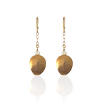 Luxury handcrafted shell earrings inspired by hidden treasures of the sea.