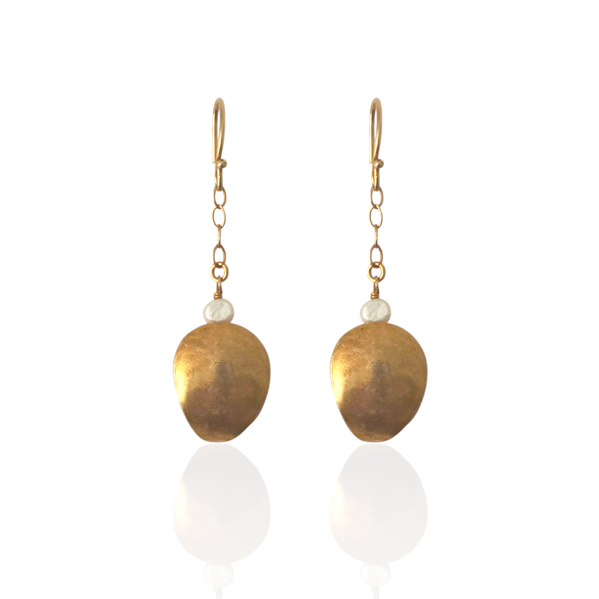 Luxury handcrafted shell earrings inspired by hidden treasures of the sea.