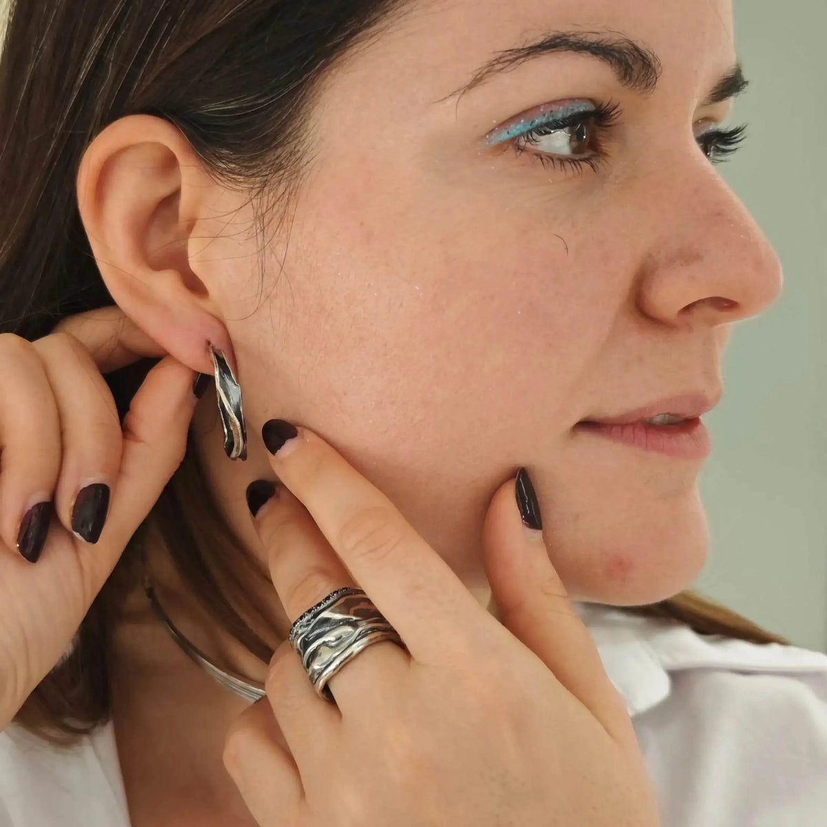 Handmade Athenais Notos Ring with zircons, paired with silver Athenart earrings and necklace