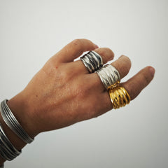 Athenais wide draped ring worn on hand, oxidized sterling silver finish