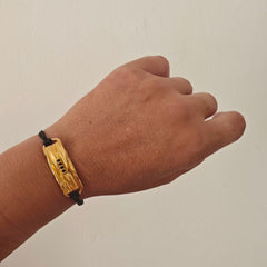 Side view of Peplos drapé bar bracelet showing sculpted folds texture