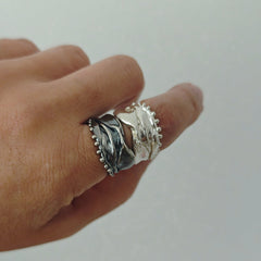 Athenais Hemline Rings in polished silver and oxidized silver, showing contrasting finishes and beaded edges