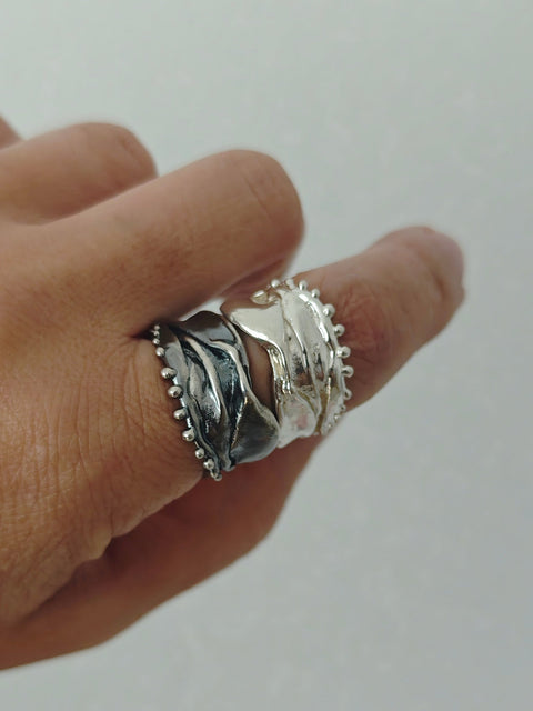 Athenais Hemline Rings in polished silver and oxidized silver, showing contrasting finishes and beaded edges