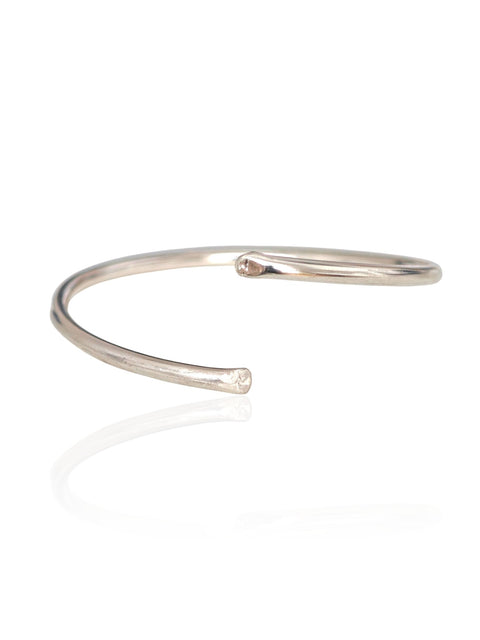 Silver bangle on a white background