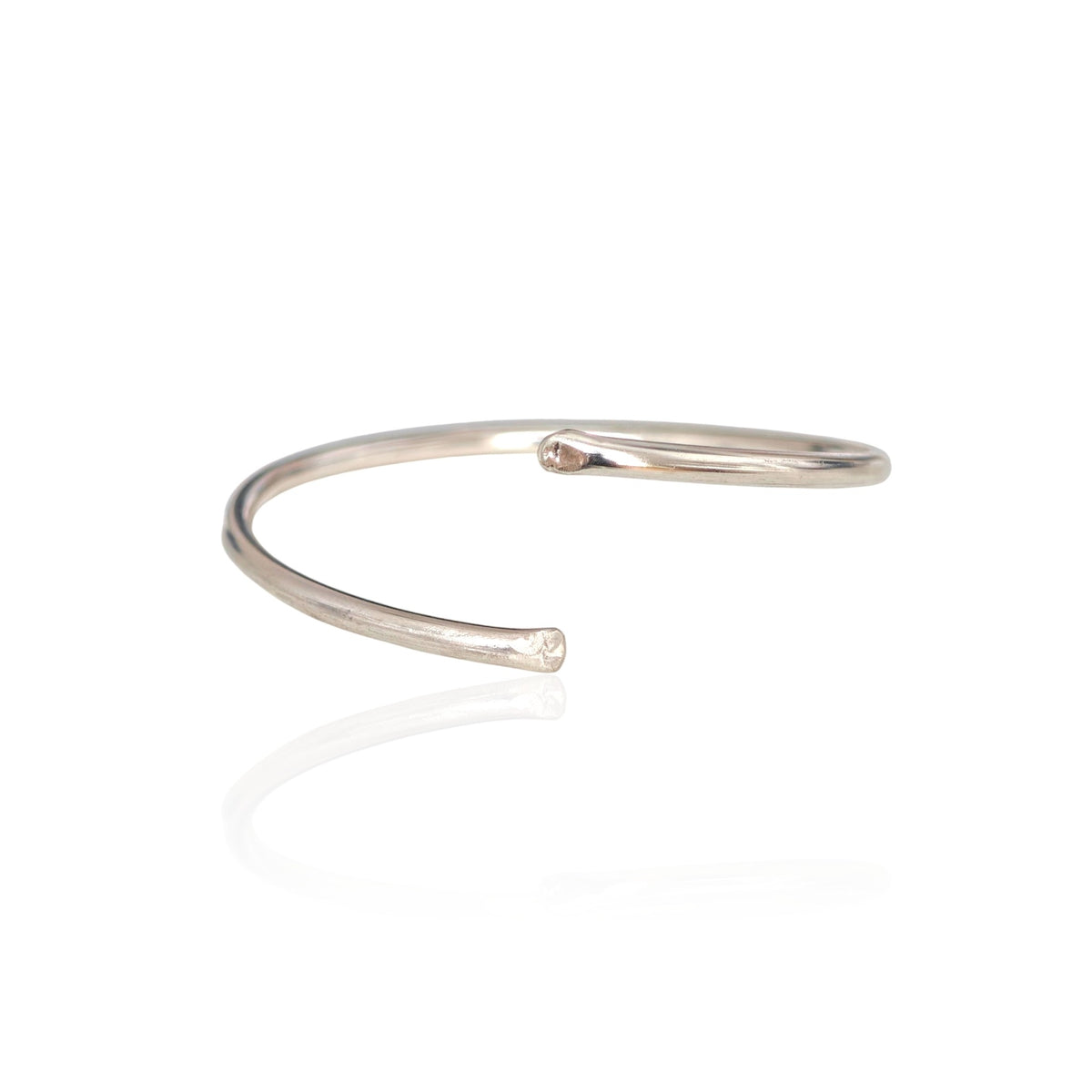 Silver bangle on a white background