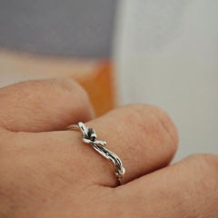 One-of-a-kind sterling silver sculptural ring with reclining human figure, worn on hand, size 55.5–56