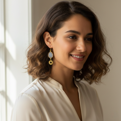 Close up earrings with sun and quartz stone