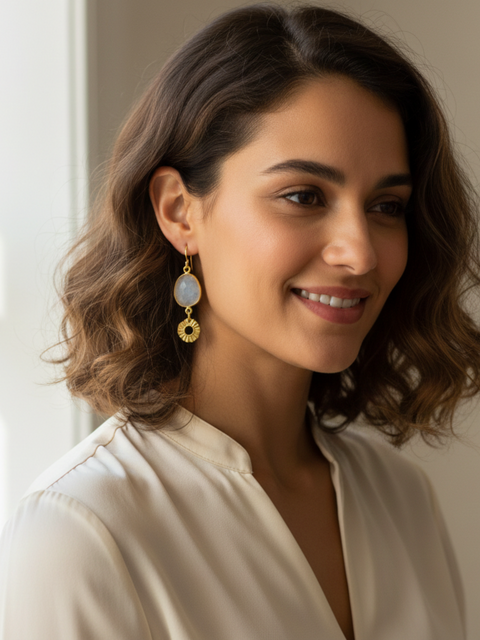 Close up earrings with sun and quartz stone