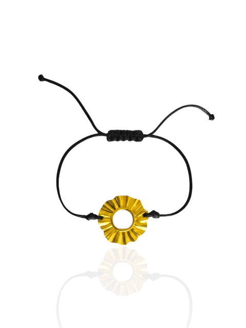 Black cord bracelet with a gold circular charm on a white background. Sun Lucky charm forever 