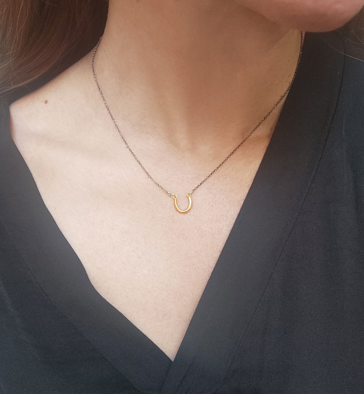 Mini horseshoe necklace in gold plated 925 sterling silver by Athenart, featuring a tiny 1 cm lucky charm pendant, handcrafted in Athens.