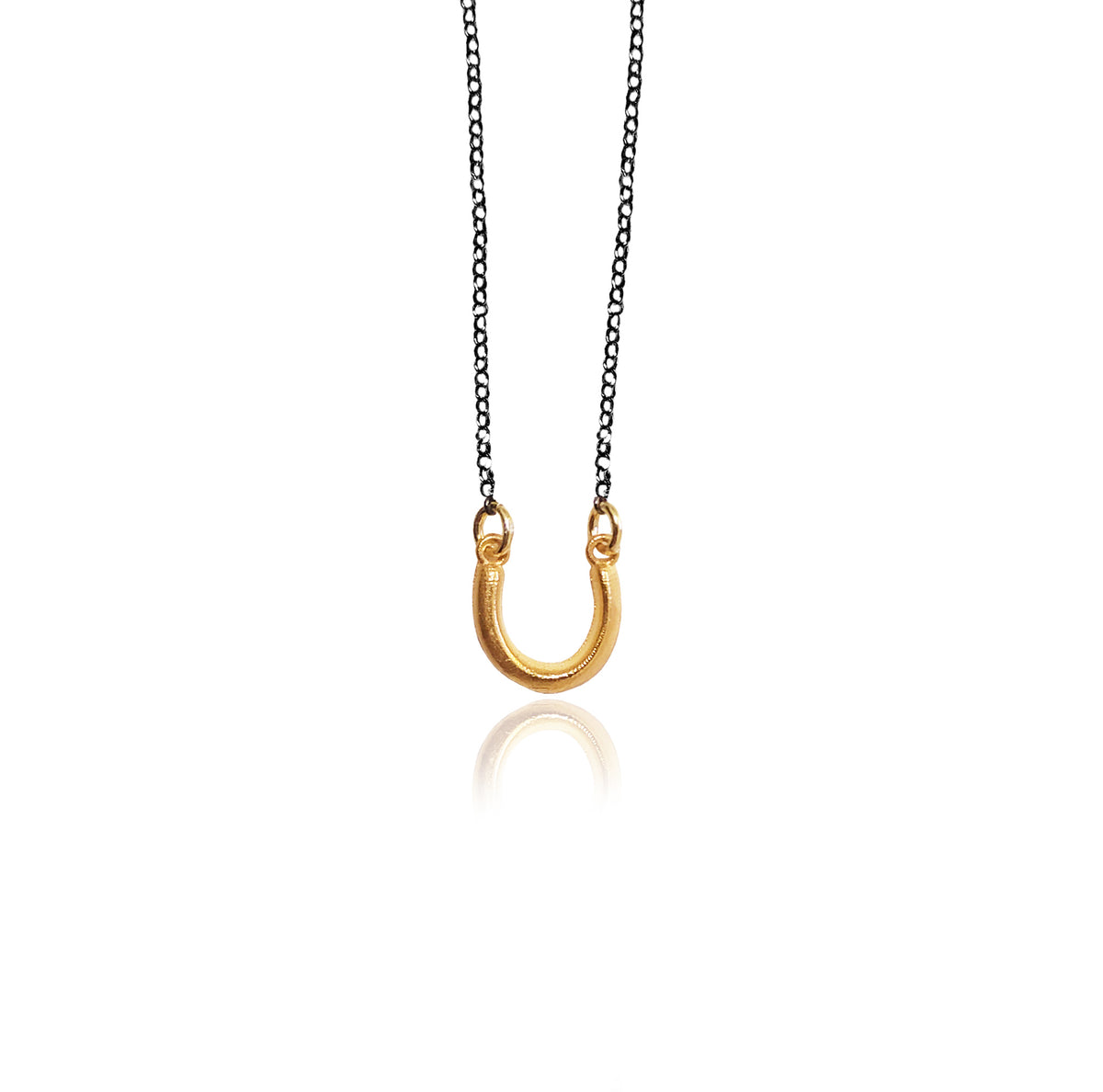 Handmade mini horseshoe necklace in 925 sterling silver by Athenart, a delicate Greek good luck talisman with a minimalist design.