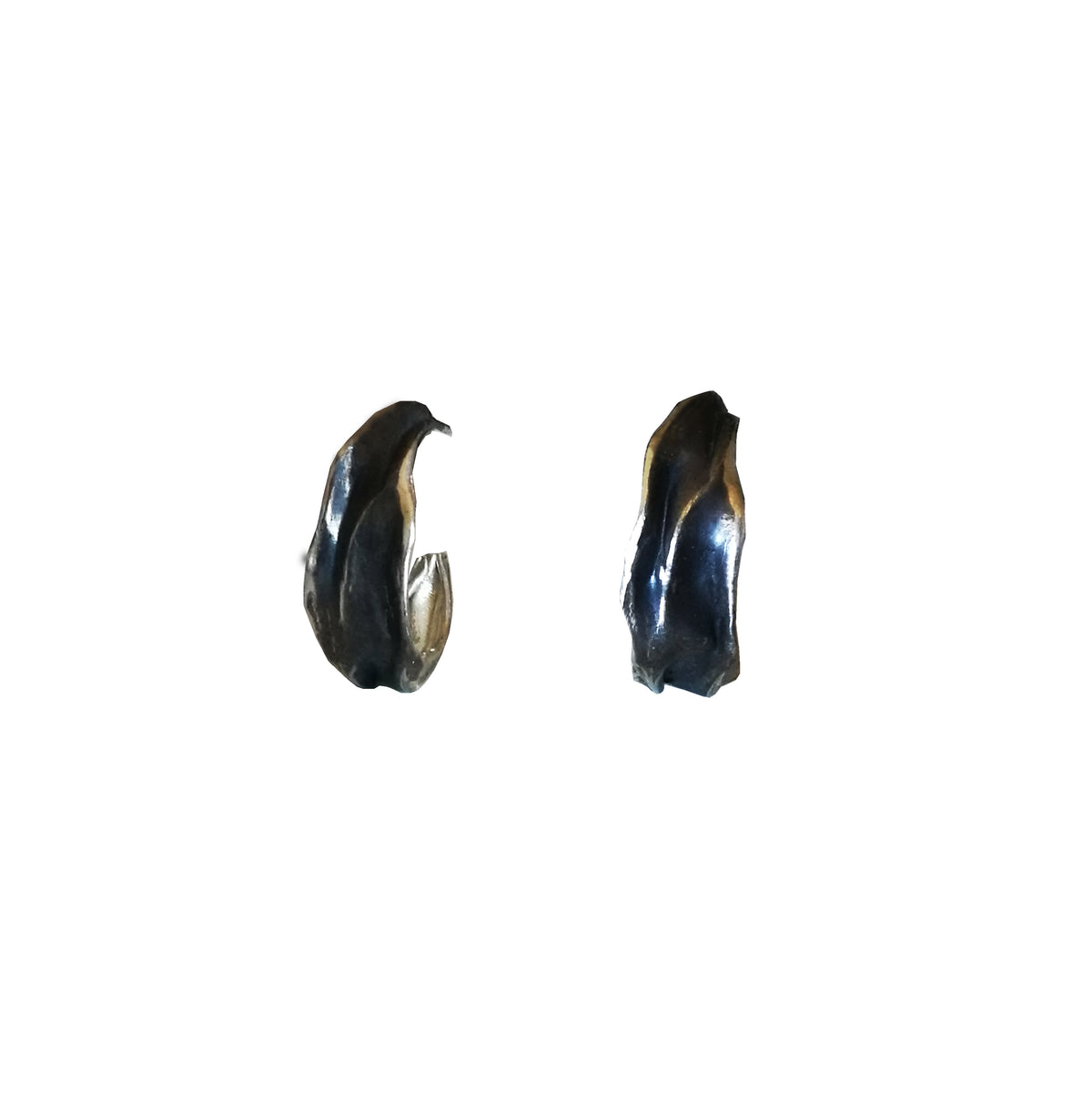 Athenais Drapé Hoops in oxidized 925 silver showing dark highlights and fold texture, product on white