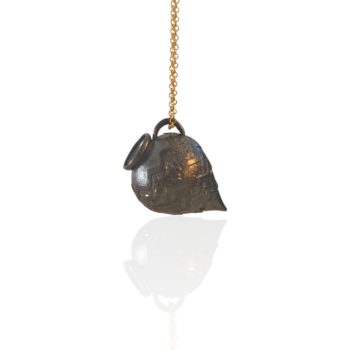 Ancient Whisper oxidized silver Amphora necklace with gold-plated chain on a white background