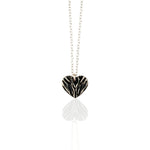 Necklace with a folded  silver heart pendant on a white background